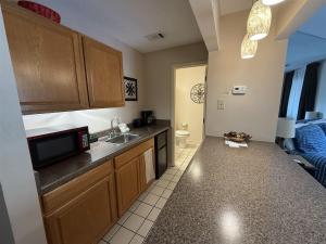 a kitchen with a sink and a microwave at Rivers Edge 803c in Helen