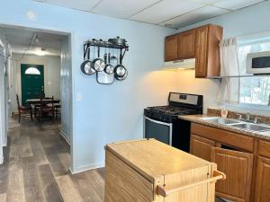a kitchen with a sink and a stove top oven at Queen Bed Private Room Shared Living Spaces in Johnson City