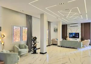 a large living room with couches and a television at Luxury Royal Blue Family Villa 8pers private pool in Hurghada +59 photos