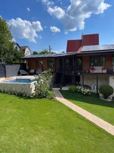 a house with a swimming pool in a yard at Хлеча house in Stantsiya Korchi