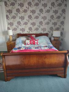 a bed with two pillows on it in a bedroom at 95 St Mary Street in Kirkcudbright +3 photos