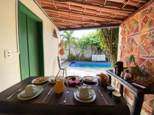 a table with plates of food on top of it at Pousada O Refúgio in Jericoacoara