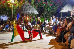 a couple of people dancing in front of a crowd at Keur Saloum Resort in Toubakouta