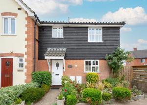 a brick house with a black roof at 3 Bed in Wangford oc-frs in Wangford