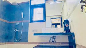 a bathroom with a sink and a shower at Villa 188 Yala in Tissamaharama