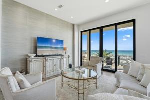 a living room with a view of the ocean at Honeysuckle Blue in Pensacola Beach