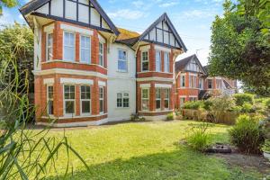 an exterior view of a large house with a yard at 2 Bed in Bexhill-on-Sea oc-t29534 in Bexhill