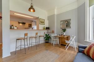 a living room with a kitchen and a table and chairs at 2 Bed in Bexhill-on-Sea oc-t29534 in Bexhill +12 photos