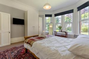a bedroom with a large bed with a teddy bear on it at 2 Bed in Bexhill-on-Sea oc-t29534 in Bexhill
