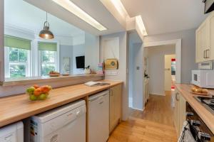 a kitchen with a bowl of fruit on a counter at 2 Bed in Bexhill-on-Sea oc-t29534 in Bexhill