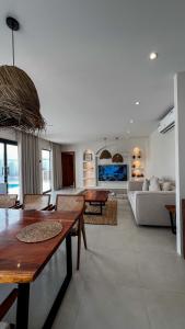 a living room with a table and a couch at Raml villa in Ras al Khaimah