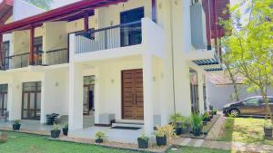 an image of a house with a front door at Villa 188 Yala in Tissamaharama
