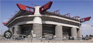 a large soccer stadium with a large building at Mami Home Milano Con parcheggio tax1euro in Cormano