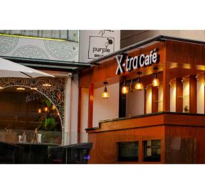 a restaurant with a sign that reads x two cafe at Purple Brigade, Bangalore in Bangalore