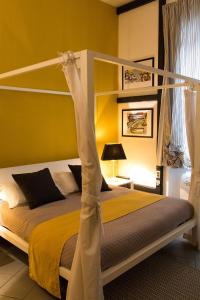 a bedroom with a bunk bed with a pole at Snob Luxury Suite in Cagliari +85 photos