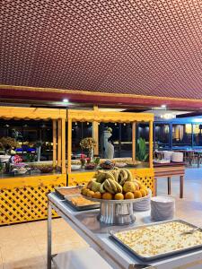 a buffet with a plate of food on a table at Golden Stars Luxury Camp Wadi Rum in Wadi Rum +76 photos