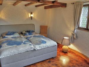 a bedroom with a bed in a room with a window at Rheinvilla Weitblick in Boppard