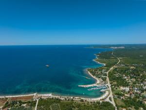 an aerial view of a beach with a boat in the water at Apartment Lola in Peroj