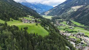 an aerial view of a village in the mountains at Mittagsspitz am Bauernhof in Flattach