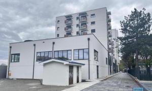 a large white building with a lot of windows at Harmony Studio Suite in Jagodina