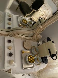a camera and some cupcakes on a ceiling at Graeco-Roman Residence-Delilah in Alexandria