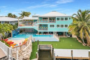 an aerial view of a house with a swimming pool at Bumpa's Big House in Marathon