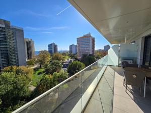 a balcony with a view of a city at Apart HOTEL VOGH OLIMP - S605 in Văleni