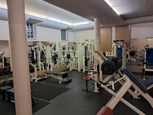 a gym with a bunch of equipment in it at Hotel Maggi in Rogoźno