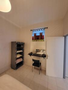a room with a chair and a white door at your cute house in Salé