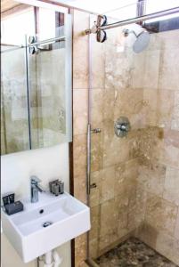 a bathroom with a sink and a shower at NEW! Modern Cabin Tiny Home at Cliffside #3 in Orderville