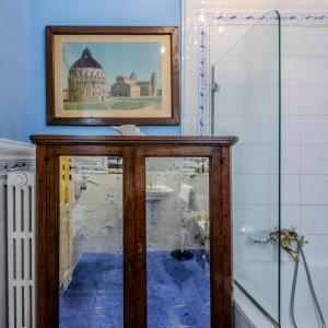 a museum exhibit with a picture on the wall at Casa Esvael - Historic Rooms in Verona City Center in Verona