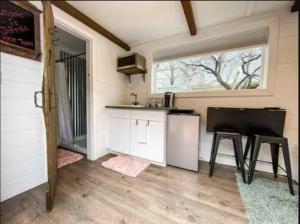 a tiny house with a kitchen and a piano at NEW! Cozy Container Home at Cliffside #1 in Orderville