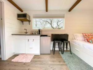 a tiny house with a kitchen and a couch at NEW! Cozy Container Home at Cliffside #1 in Orderville