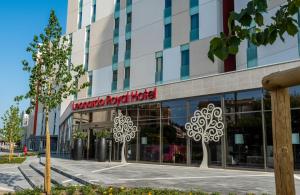 a building with a hotel sign in front of it at Leonardo Royal Hotel Venice Mestre in Mestre