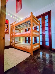a bedroom with two bunk beds in a room at Vila Urban Hostel ॐ Jardins in São Paulo +24 photos