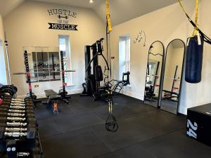 a room with a boxing gym with a punching bag at Goring River Retreat with Gym and Wellness Area in Goring