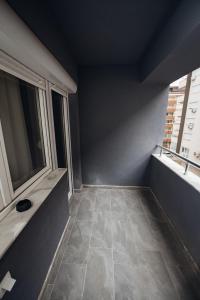 a bathroom with a large window and a tiled floor at NeWave Apartment 2 in Strumica