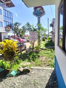 a sign for a shrimp dip restaurant on a street at PAULIN Surf in Montañita