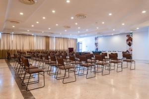 a room with a bunch of chairs and a screen at Hotel Suites Villasol in Puerto Escondido +47 photos