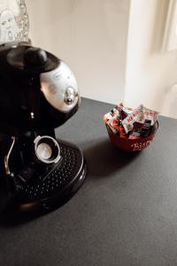 a camera and a bowl of candy on a table at A casa di Mimma in Acquasparta