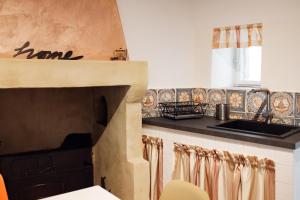a kitchen with a counter top and a sink at A casa di Mimma in Acquasparta
