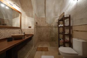 a bathroom with a toilet and a sink at Hikmet's House in Avanos +146 photos