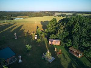 an aerial view of a yard with a house and trees at Arboretum Vlasenice in Vlasenice