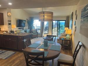 a kitchen and living room with a table and chairs at Beautiful view from a peaceful place in St. George Island
