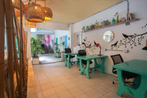 a restaurant with two tables and chairs in a room at Hotel Barahona Cartagena in Cartagena de Indias