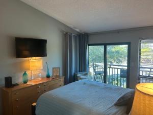 a bedroom with a bed and a balcony at Beautiful view from a peaceful place in St. George Island +16 photos