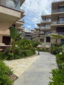 a walkway in front of a apartment building at Beach Loft Style and Beach Heated Pool in Mazatlán