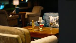 a table with two glasses of wine on it at Majestic Hotel in Tramore