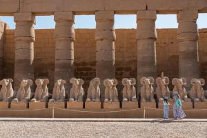 a group of woman statues in front of a building at Yellow House on the Nile in Luxor
