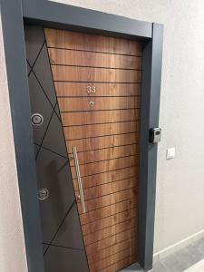 a wooden elevator door in a building at NeWave Apartment 2 in Strumica